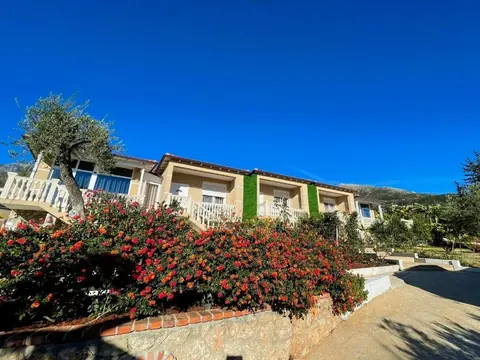 The villas at Essos Villas among gardens in Dhërmi