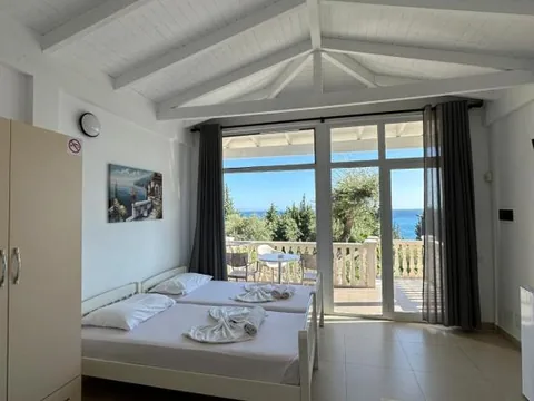 Room with a balcony and sea views at Essos Villas in Dhërmi
